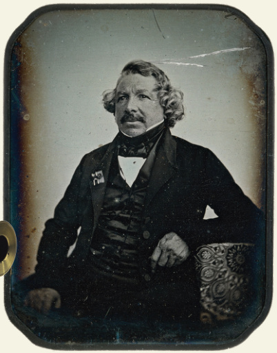 Daguerreotype camera. Portrait of Louis Daguerre.